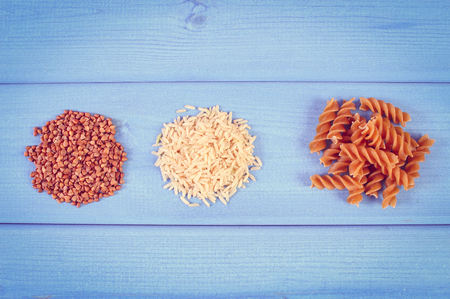 Vintage photo, Wholemeal pasta, brown rice and buckwheat containing magnesium and dietary fiber, healthy food and nutritionの写真素材
