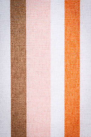 Colorful fabric as background, striped tablecloth texture as backdrop