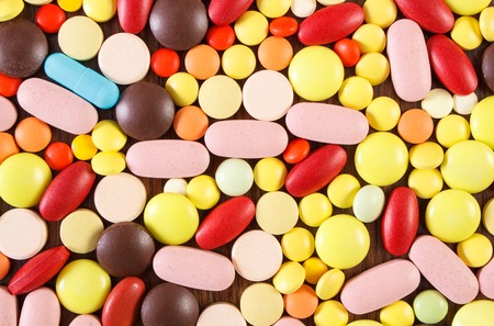 Heap of colorful medical pills, capsules or supplements for therapy as backgroundの写真素材