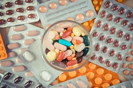 Vintage photo, Colorful medical pills and capsules for therapy and blisters of tablets or supplementsの写真素材