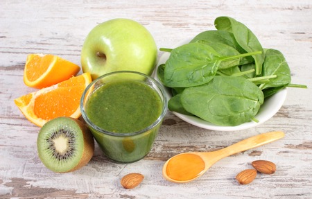Ingredients and spices for fresh green nutritious cocktail from spinach on old rustic wooden background, healthy nutritionの写真素材
