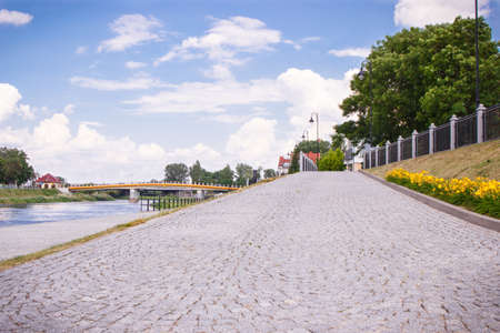 Konin, Poland - June 18, 2016: View on bridge and embankment of Warta river in polish town Konin,...