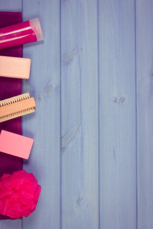 Cosmetics and accessories for personal hygiene in bathroom, soap, body scrub, towel, bath puff, brush, pumice, concept of body care, copy space for textの写真素材