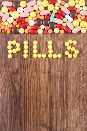 Inscription pills and medical tablets, capsules or supplements for therapy, concept of treatment and health care, copy space for textの写真素材
