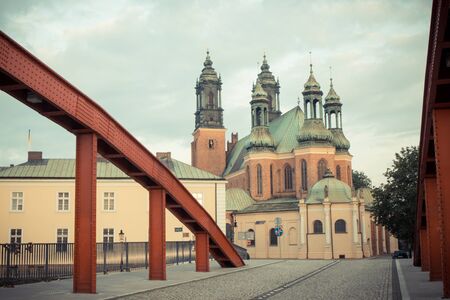 Poznan, Poland - June 29, 2016: Vintage photo, View on bridge and cathedral church of St. Peter and...