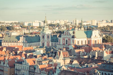 Poznan, Poland - August 30, 2016: Vintage photo, View at sunset from tower on old and modern buildings and collegiate church in center of polish city Poznanのeditorial素材