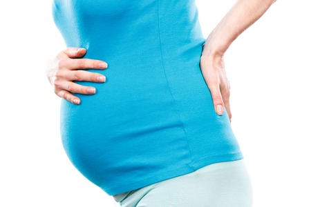 Pregnant woman with stomach pain or back aches, concept of health care, suffering, nausea or...