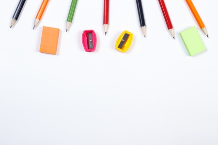 School and office accessories lying on white background, copy space for text or inscription, back to school conceptの写真素材