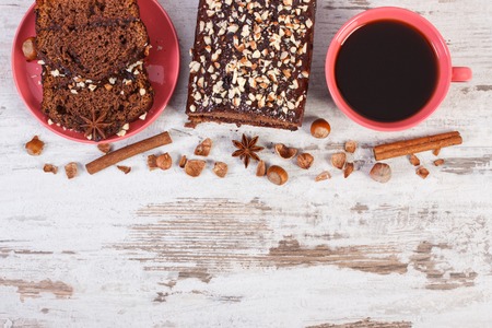 Cup of black coffee, gingerbread or dark cake with cocoa, chocolate and plum jamの写真素材