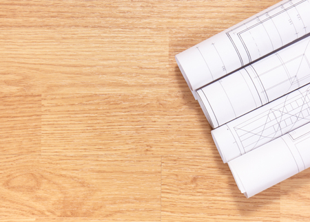 Diagrams and electrical construction drawings on wooden boards, accessories for engineer jobs, copy space for textの写真素材