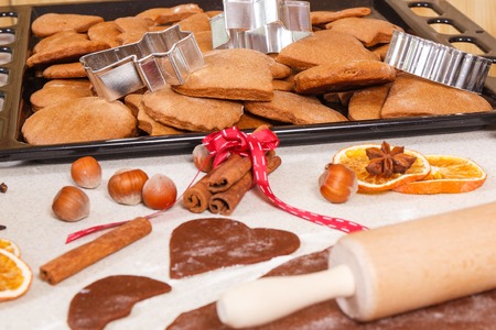 Dough, accessories for baking gingerbread and fresh baked homemade Christmas cookiesの写真素材