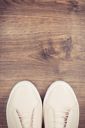 Vintage photo, Womanly leather shoes on rustic board, copy space for text or inscriptionの写真素材