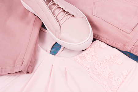 Womanly clothing and accessories, pink leather shoes, shirt and pantsの写真素材