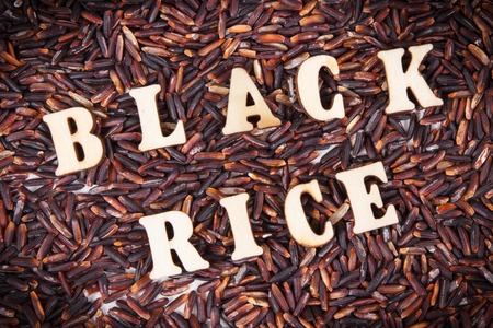 Heap of black rice, concept of healthy and gluten free nutritionの写真素材
