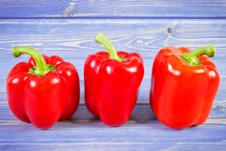 Red peppers lying on purple boards, concept of healthy nutritionの写真素材
