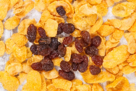 Cornflakes and dried raisins as source vitamins, carbohydrates, dietary fiber and mineralsの写真素材
