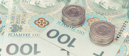 Polish currency money, banknotes and stack of coins, finance concept