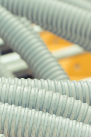 Plastic corrugated pipes as details of agricultural or industrial machinery, technology and engineering conceptの写真素材