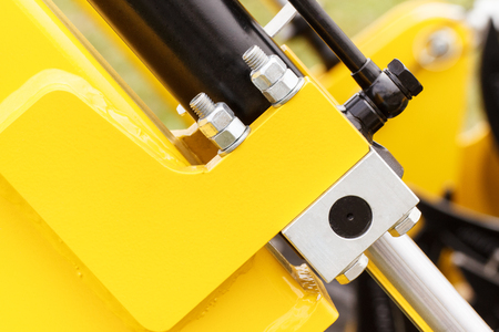 Screws, bolts and piston or actuator as part of industrial or agricultural machinery, technology and engineering conceptの写真素材