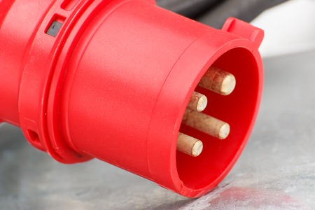 Closeup of industrial electric plug of machinery with cable, technology and engineering conceptの写真素材