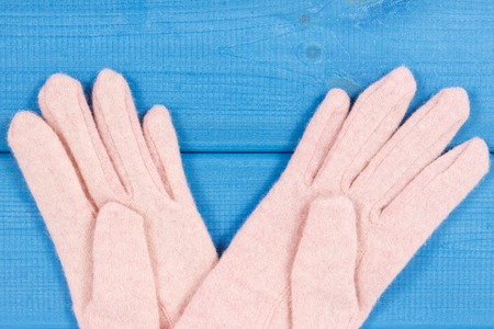 Gloves for woman made of wool or cotton, concept of clothing for autumn or winter