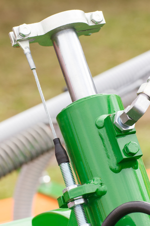 Detail and part of industrial hydraulic or pneumatic machinery made of steel, piston or actuator, engineering and technology conceptの写真素材