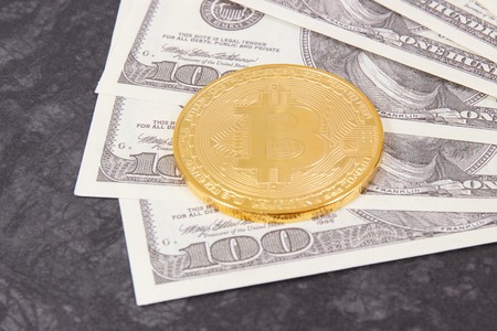 Bitcoin as symbol of electronic virtual money and dollar, choice between traditional paper money and cryptocurrencyの写真素材