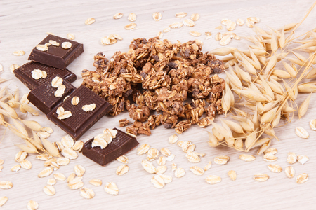 Granola, oat flakes and chocolate as source iron and fiber, concept of healthy snackの写真素材