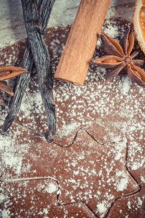 Vintage photo, Dough for Christmas cookies with spice and ingredients for bakingの写真素材