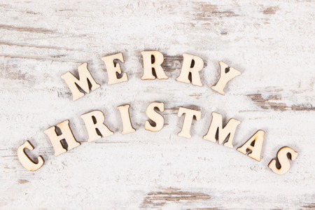 Inscription Merry Christmas on rustic board, concept of festive timeの写真素材