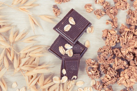 Granola, oat flakes and chocolate as source iron and fiber, concept of healthy snackの写真素材