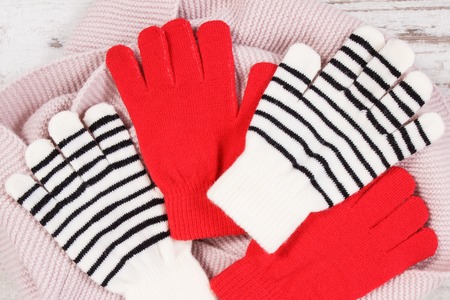 Gloves and scarf for woman made of cotton or wool, warm clothing for autumn or winterの写真素材