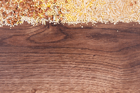 Groats, brown rice, amaranth and quinoa seeds, concept of healthy, gluten free food and nutrition, copy space for textの写真素材