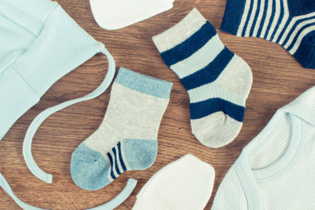 Blue clothing for newborn baby, concept of expecting for kids and extending familyの写真素材