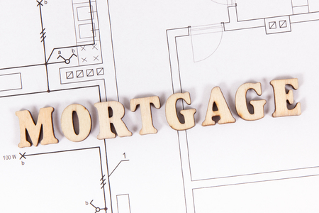 Inscription mortgage on construction diagrams, concept of buying or building houseの写真素材