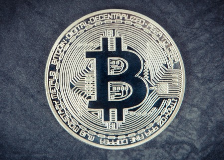 Bitcoin, cryptocurrency coin on dark background, concept of modern finance and banking