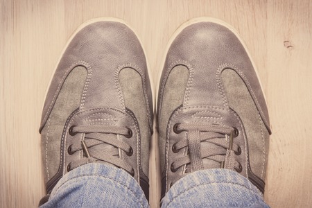Elegant stylish comfortable gray shoes for men on white board. Vintage photoの写真素材