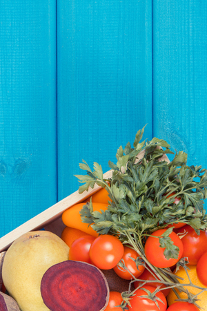 Fresh ripe fruits and vegetables in wooden box. Healthy eating, nutrition, slimming and dieting concept, copy space for textの写真素材