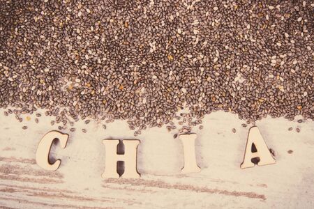 Vintage photo, Inscription chia and seeds, concept of food containing natural vitamins, minerals and dietary fiberの写真素材