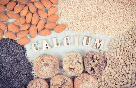 Vintage photo, Inscription calcium and natural food containing dietary fiber and minerals, concept of healthy nutritionの写真素材