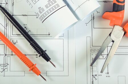 Cables of multimeter and pliers on construction drawings of house. Building home concept. Drawings for projects engineer jobsの写真素材
