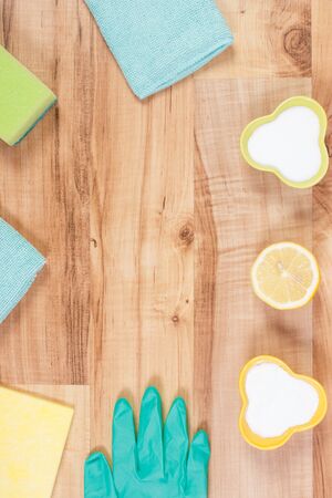 Accessories and natural, nontoxic detergents for cleaning different surfaces at home, concept of household duties, copy space for text on rustic boardの写真素材