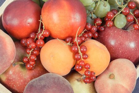 Fresh natural fruits in wooden box. Nutritious food containing healthy minerals and vitamins