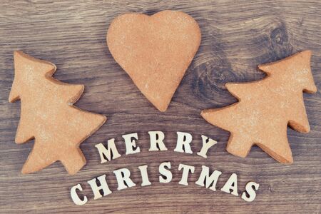 Vintage photo, Gingerbreads or festive cookies with inscription Merry Christmasの写真素材