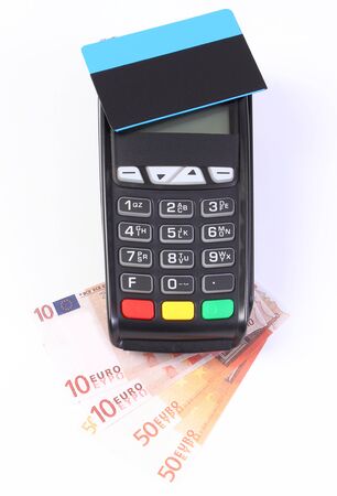 Payment terminal with contactless credit card and currencies euro. Choice between cashless or cash paying for shopping or productsの写真素材