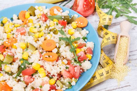 Fresh salad with vegetables and couscous groats. Light meal containing natural vitamins and mineralsの写真素材