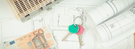 Currencies euro, home keys, electrical drawings or diagrams for engineer jobs and house under...