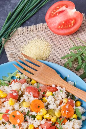 Fresh salad with vegetables and couscous groats. Light and healthy meal containing natural vitamins and mineralsの写真素材