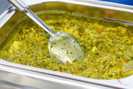Fresh prepared eating with chicken, curry and vegetables. Oriental cuisine