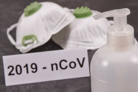 Disinfectant liquid with alcohol for disinfection hands and protective mask N95. Stop spreading outbreak coronavirus. Covid-19. 2019-nCoVの写真素材